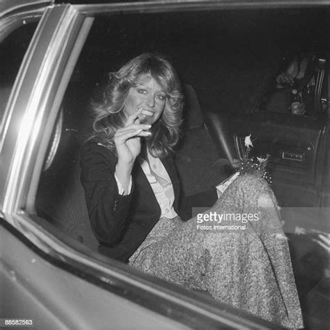 american actress farrah fawcett waves and smiles from her car as she news photo getty images