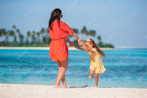 Premium Photo Beautiful Mother And Daughter At Caribbean Beach Enjoying Summer Vacation