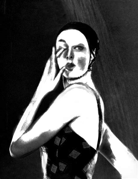A Black And White Photo Of A Woman Holding Her Head