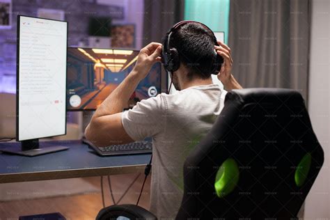 Gamer Puts On Headphones Stock Photos Motion Array