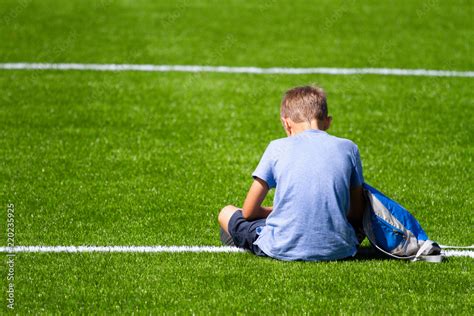 Sad Alone Boy With Backpack Sitting Stadium Outdoors Stock Photo