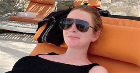 pregnant lindsay lohan beams as she shows off bump in swimsuit ahead of due date ok magazine