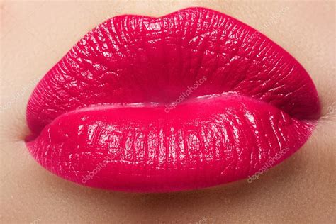 close up of a beautiful sexy red lips giving kiss nice full lips with pink lips makeup fashion