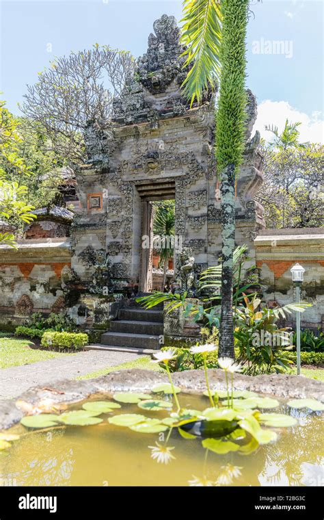 Entrance Gates Paduraksa With Stone Carving At Bali Museum In