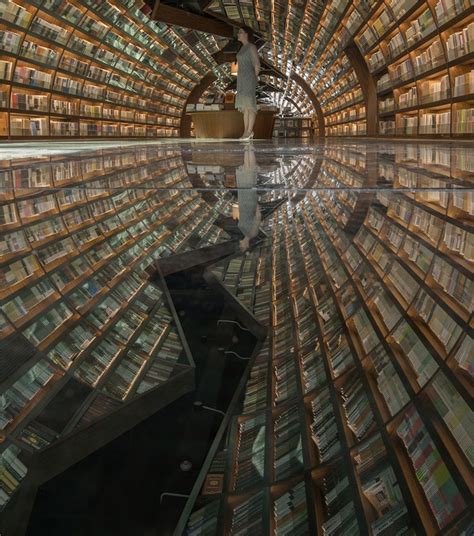 Stunning Bookstore Uses Mirrored Flooring To Create Giant Optical Illusion