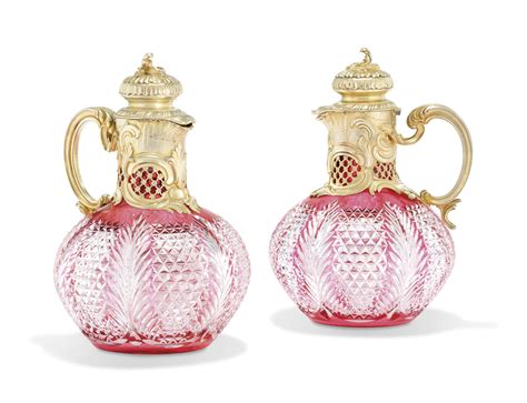 A Pair Of Silver Mounted Cut Glass Claret Jugs Marked K FabergÉ With