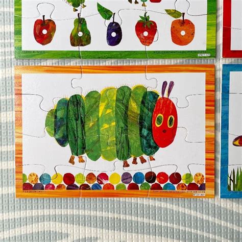 The Very Hungry Caterpillar Puzzles Are On Display In Front Of Each Other