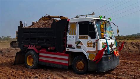 dump truck excavator excavator loading truck truk