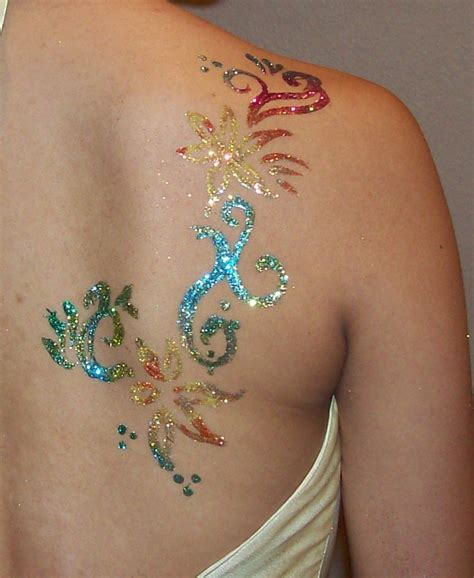 Colorful And Glittery Shoulder Blade Tribal Tattoos For Women