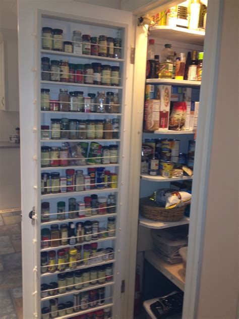 I have a built in spice rack (converted from an ironing board cabinet. Kitchen. white wooden pantry kitchen cabinet door with ...