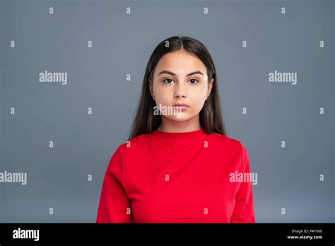 Portrait Of A Chubby Dark Haired Girl In Red Pullover Stock Photo Alamy