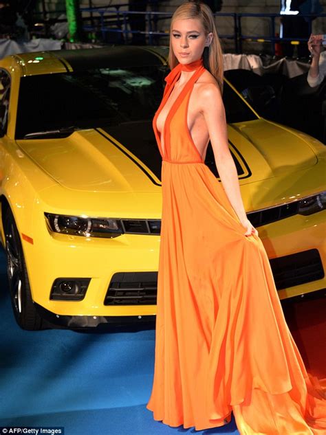 Nicola Peltz Goes Braless In An Orange Gown At The Transformers Age