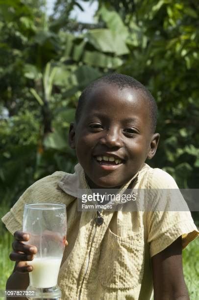 African Child Drinking Milk From A Glass Photos And Premium High Res