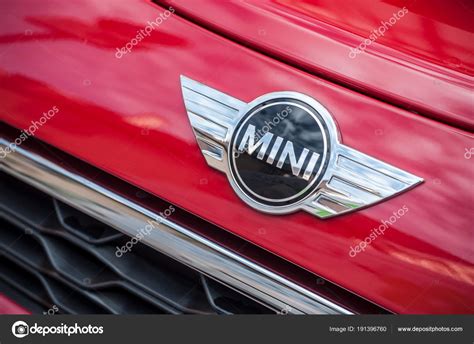 Retail Of Austin Mini Cooper Logo On Red Car Parked In The
