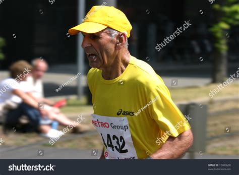 Senior Marathon Runner On His Way To The Finish Stock Photo 12403600