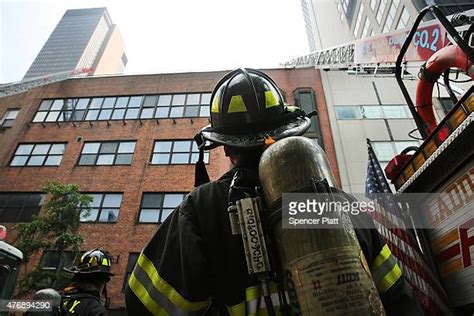 Fdny Firefighter Photos And Premium High Res Pictures Getty Images