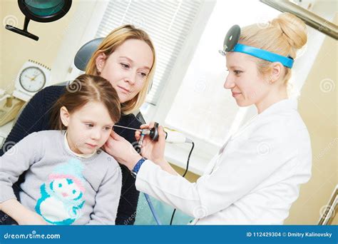 Ear Nose Throat Examining Ent Doctor With A Child And Endoscope