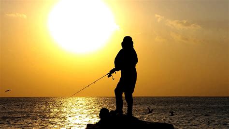 Person Fishing On The Shore At Sunset Image Free Stock Photo Public
