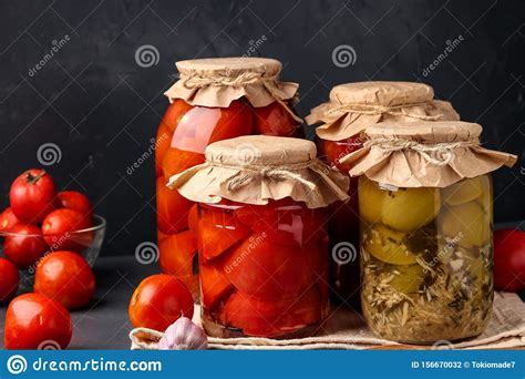 Different Types Of Canned Tomatoes, Halves Of Tomatoes, Green Tomatoes With Horseradish In Glass 