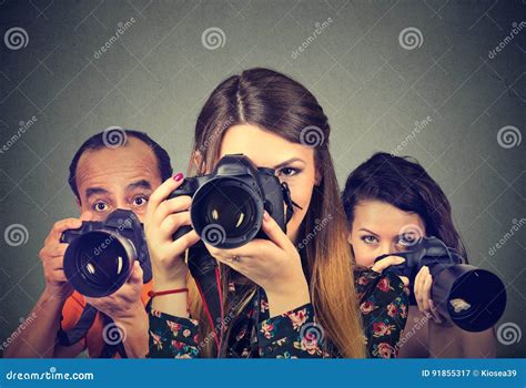 Group Of Photographers With Professional Cameras Stock Image Image Of