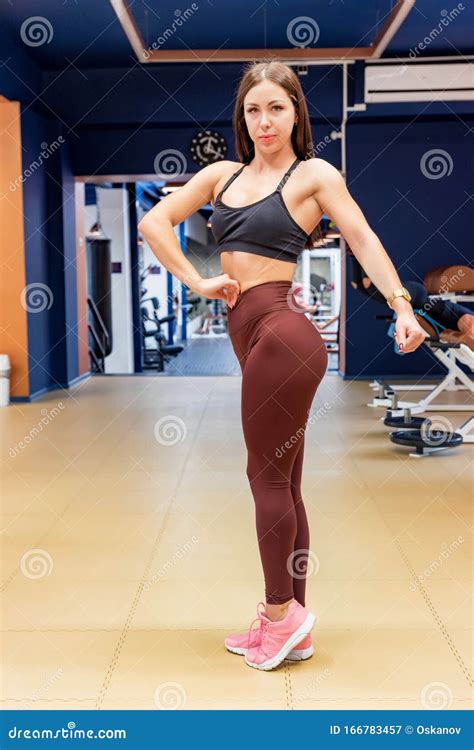 Female Fitness Model Poses Flexing In Gym Stock Image Image Of