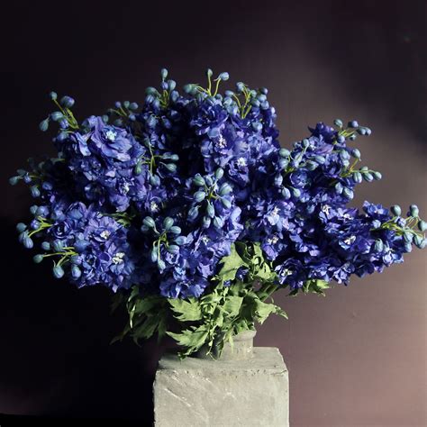 With fake flowers?insert silk flowers into the styrofoam, add ribbon around base and you've made a gorgeous bouquet. Blue delphiniums abigailahern.com/collections/flowers ...