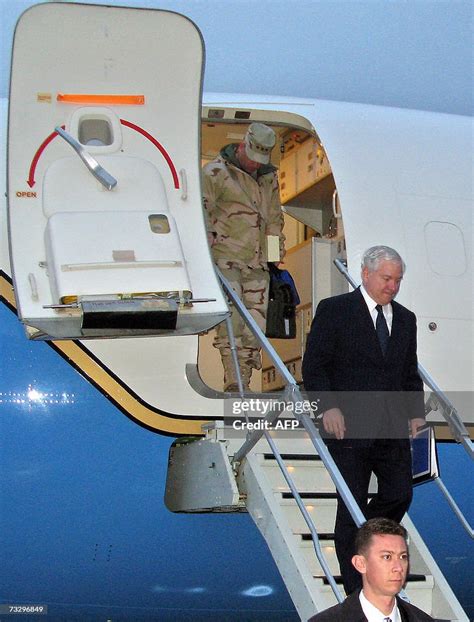 Us Defence Secretary Robert Gates Steps Down From The Plane Upon His