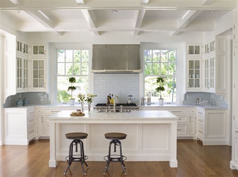 Wide open space, lots of storage and opportunity for company while you prep and cook. Example of a small classic u-shaped dark wood floor open ...