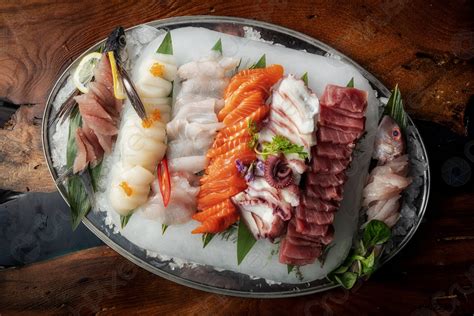 Sashimi From Different Types Of Fish On Ice Top View Stock Photo
