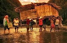 bayanihan house tradition filipino ancient people entire family move while villagers roof walls including small men gathering
