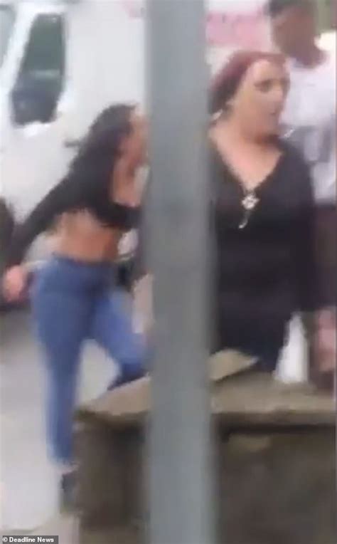 Womans Top Is Almost Ripped Off In Vicious Brawl With Another Woman On The Side Of A Busy Road