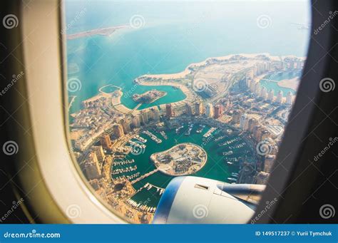Aerial View Of The Pearl Qatar Island In Doha Through The Airplane