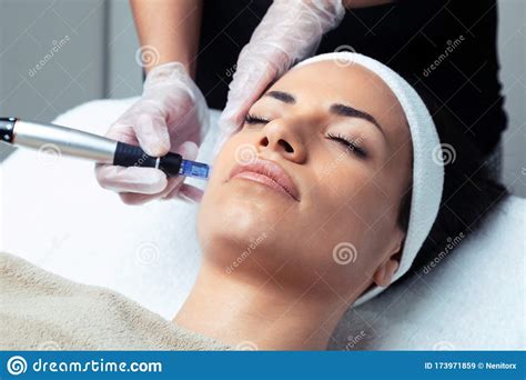 Cosmetologist Making Mesotherapy Injection With Dermapen On Face For