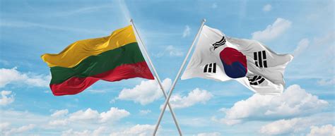 Two Crossed Flags South Korea And Lithuania Waving In Wind At Cloudy Sky Concept Of