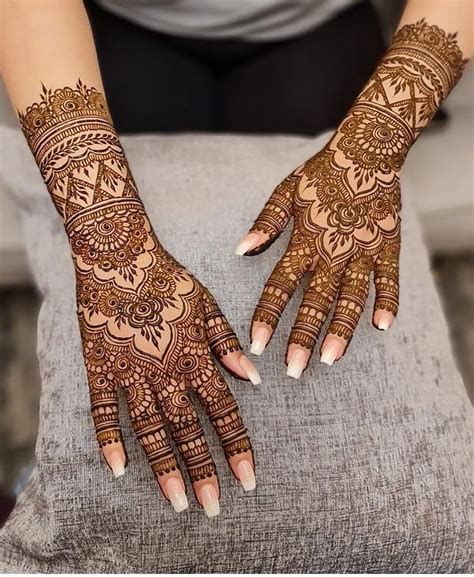 Henna Tattoos On The Hands Of A Woman