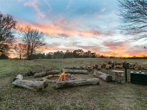 A rustic fire pit like the one in this photo can be put together with flat rocks of various shapes and sizes if you have pieces that are about the same length and thickness. 10 Amazing Backyard Fire Pits for Every Budget | HGTV's ...