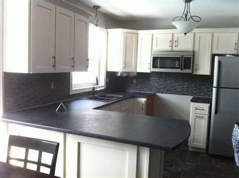 Back Glass And Black Marble Backsplash Installed By Stepping Stone