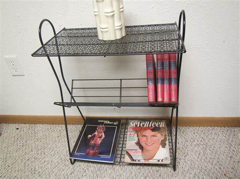 A book rack is a rack that is used to arrange books and magazines in an organized manner for the sake of easy access a book rack may usually either be a solid wood book rack, a metal bookshelf or a metal frame hanging file rack. Metal Magazine Stand Magazine End table book stand | Etsy ...