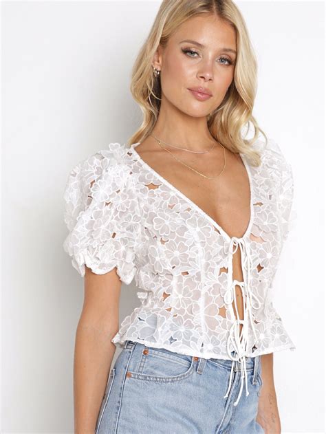 Leighton Is A Lighthearted D Floral Embroidered Blouse With Cutouts Throughout Featuring