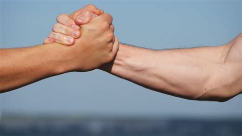 Closeup Shot Of Two Strong Men Having Firm Handshake After Training In