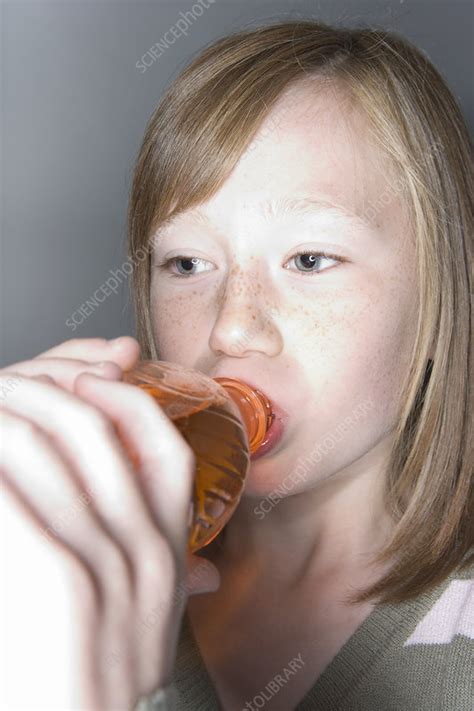 Girl Drinking A Fizzy Drink Stock Image P920 0806 Science Photo Library