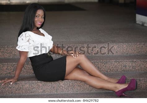 Young Black Woman Sitting Legs Crossed Foto Stock 84629782 Shutterstock