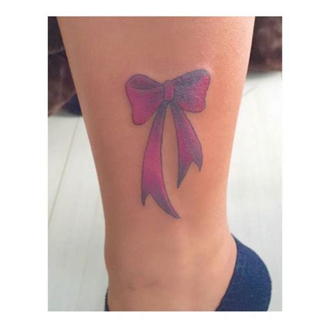 Ankle Tattoo Of A Ribbon On Miki
