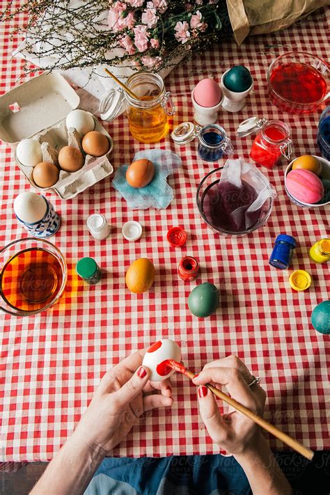 Woman Colouring Easter Eggs By Stocksy Contributor Marija Savic