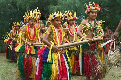 Yapese Girls In Traditional Clothing Dancing With Bamboo Pole At Yap