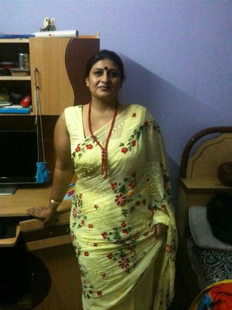 aunty saree beautiful indian tv actress pragathi aunty stills in yellow saree flower saree