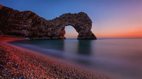 Durdle Door Natural Rock Arch At Sunset Jurassic Coast England Backiee