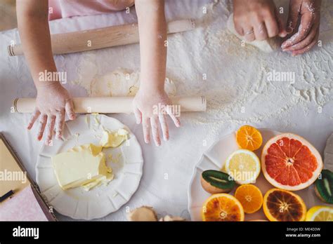 Mother Teaching Her Young Daughter To Cook Stock Photo Alamy