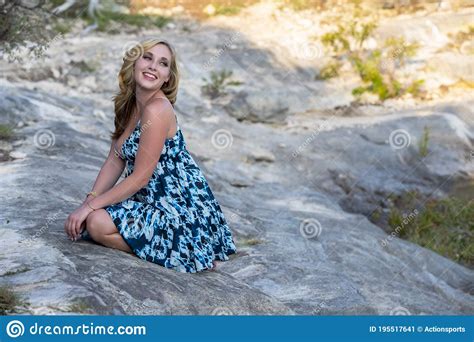 A Lovely Blonde Model Enjoys A Summers Day Outdoors At The Park Stock