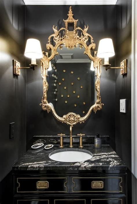 Gold And Black Powder Room Boasts Walls Painted Bold Black Lined With A